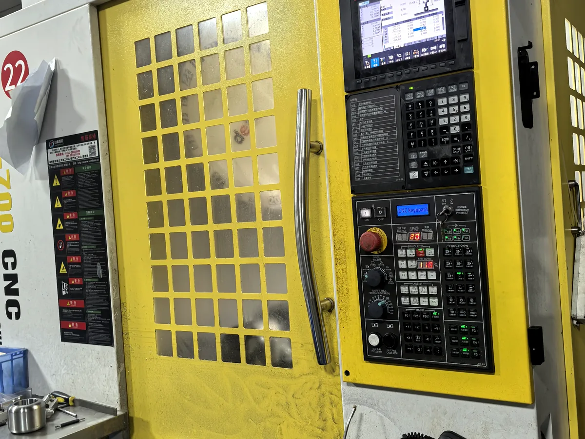 CNC machine control and enclosed machining center
